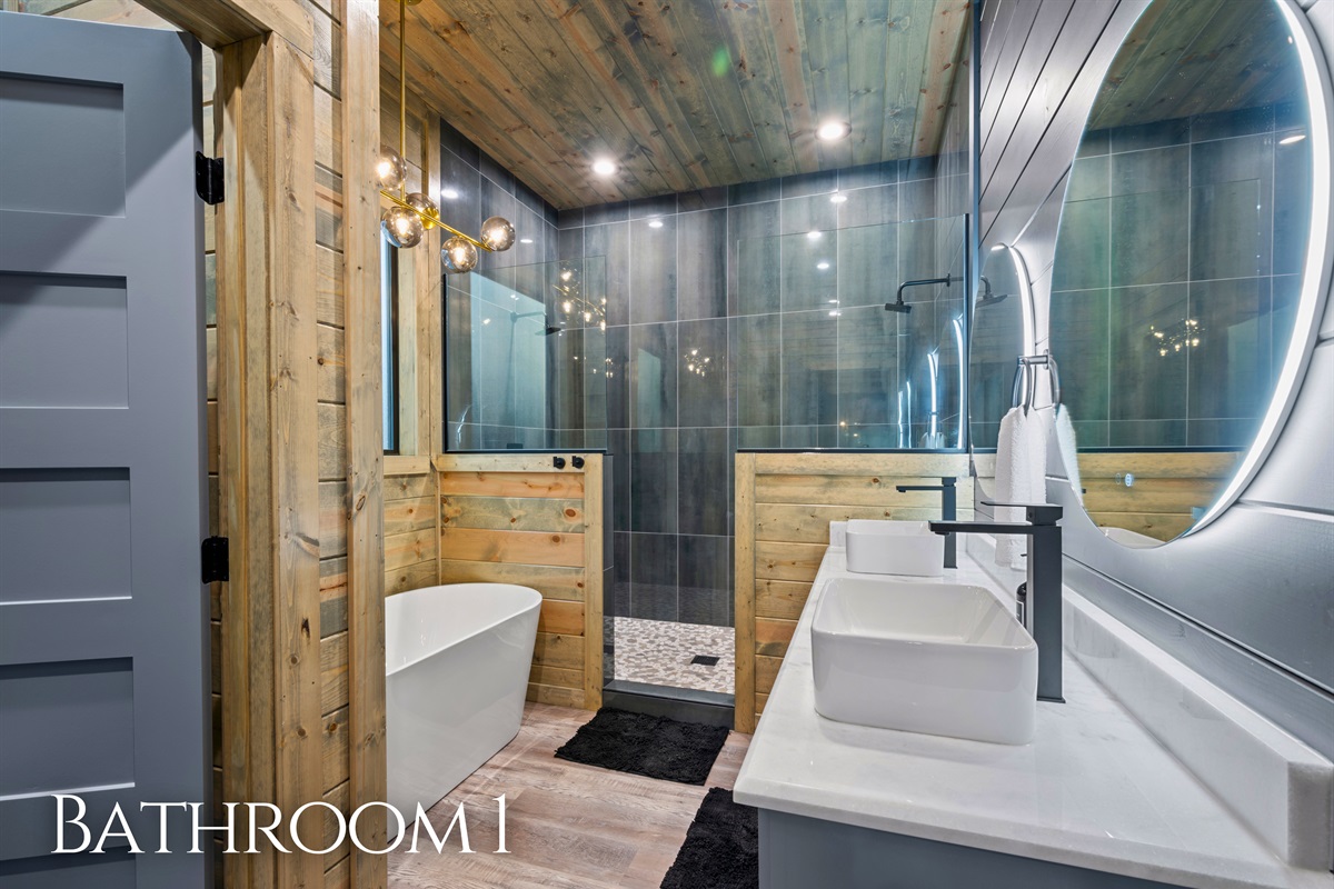 A beautifully tiled walk-in shower and modern finishes give this bathroom a clean, spa-like feel that adds a touch of luxury to your stay.
