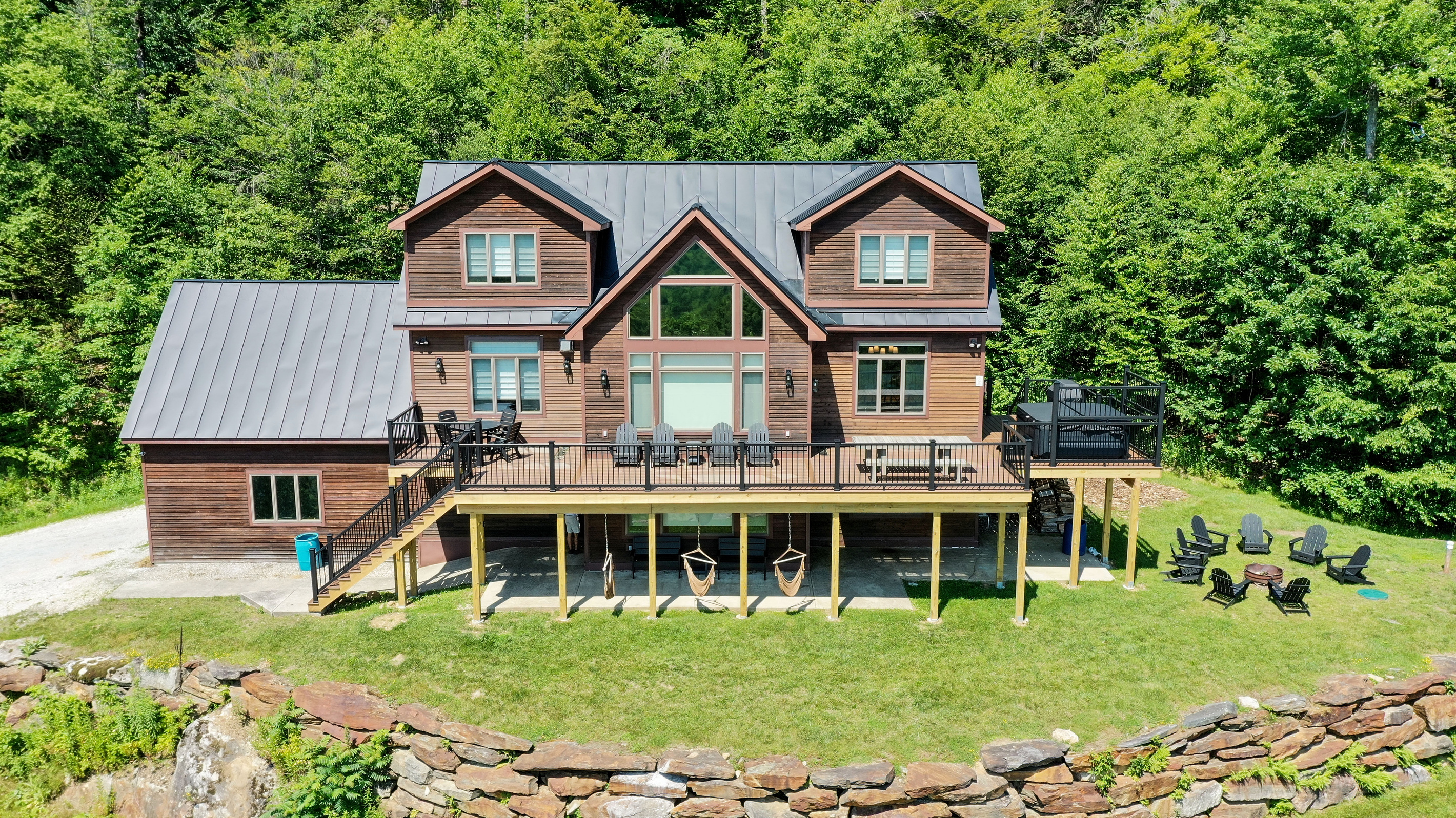 Large 3 level home with multilevel patio and deck, fire pit, hot tub, and amazing views