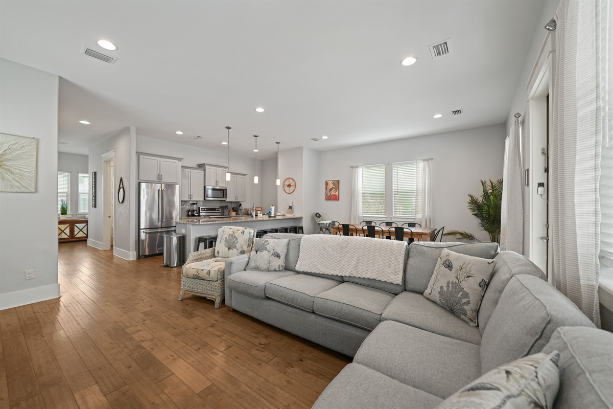 Spacious open-concept living area with plenty of seating for relaxing together