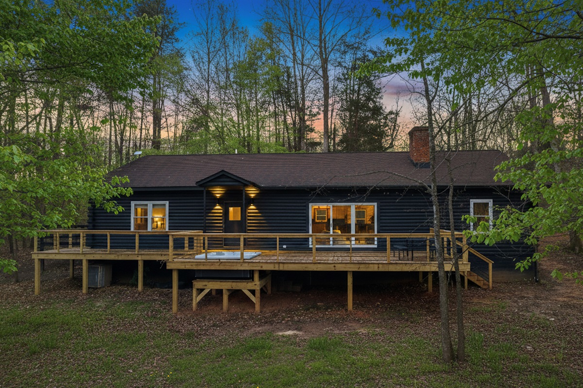 Charming Retreat: Enjoy serene forest views from the spacious deck of your private getaway!