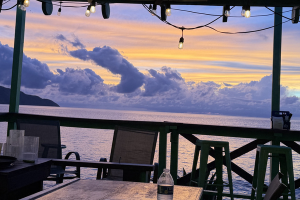 Off The Wall is a short walk or drive. A favorite of both locals and island visitors serving up consistently good bar food, a friendly bartender, and perhaps the best view on the island. 