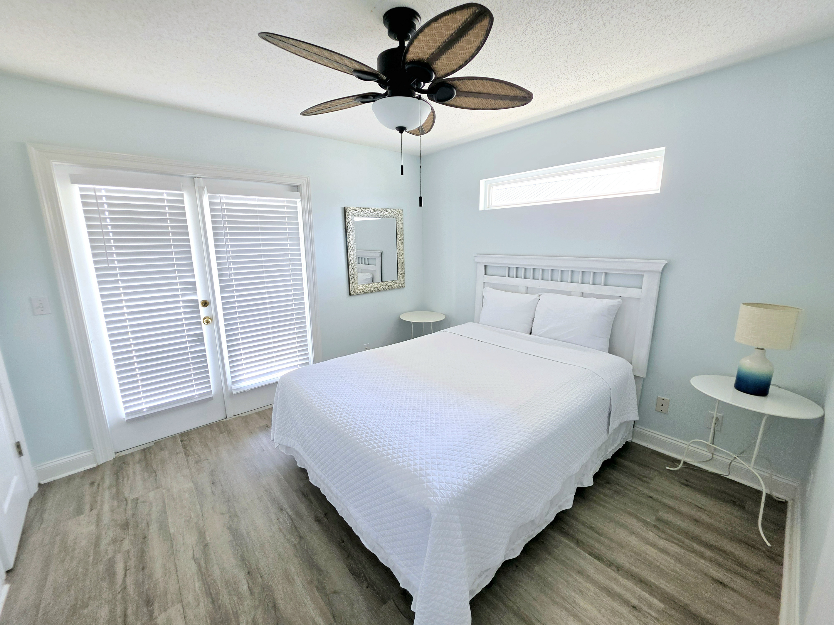 Bright bedroom with ceiling fan