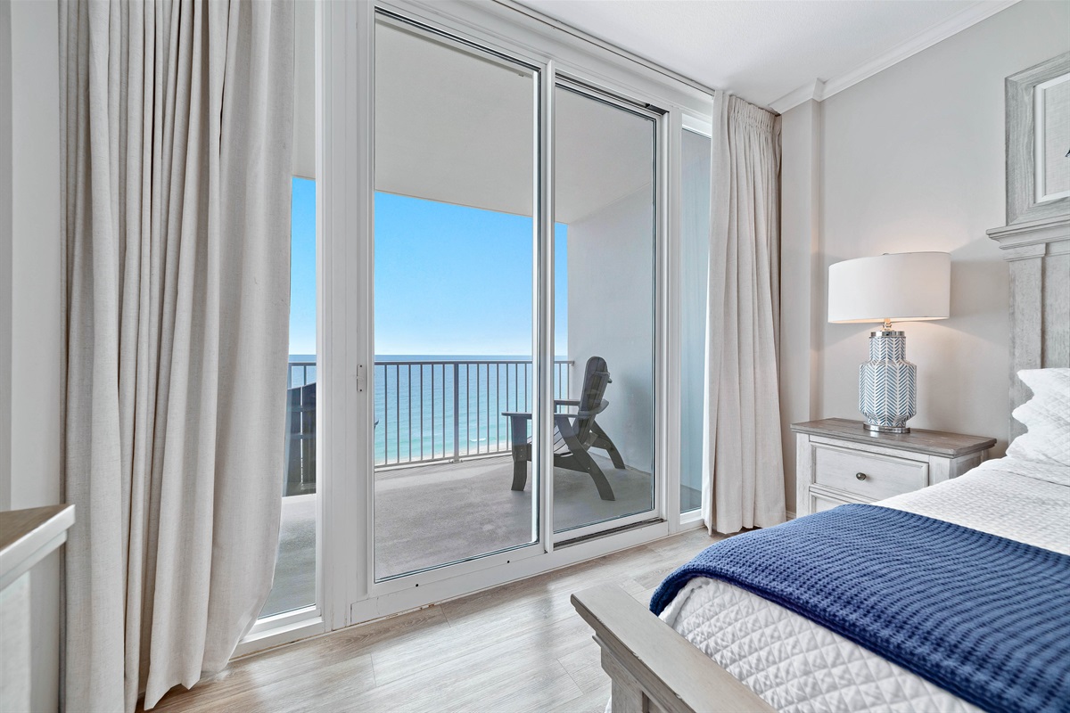 Step out onto your private balcony and enjoy the fresh sea air. This bedroom features a comfortable king-size bed and a flat-screen TV for your enjoyment.