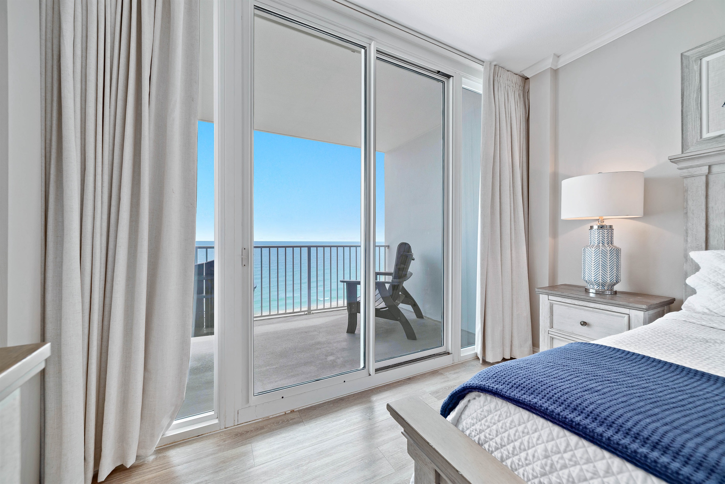 Step out onto your private balcony and enjoy the fresh sea air. This bedroom features a comfortable king-size bed and a flat-screen TV for your enjoyment.