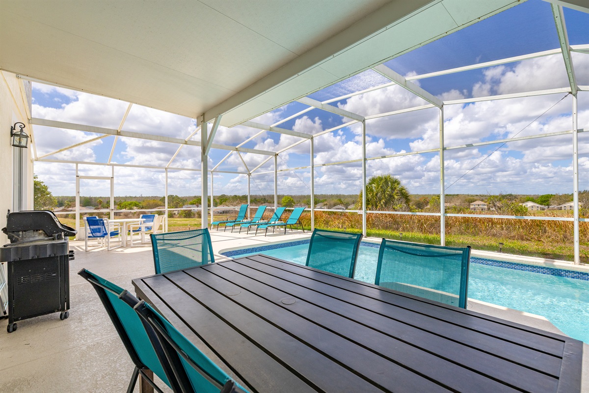 The covered lanai and BBQ grill allow for comfortable eating outside.