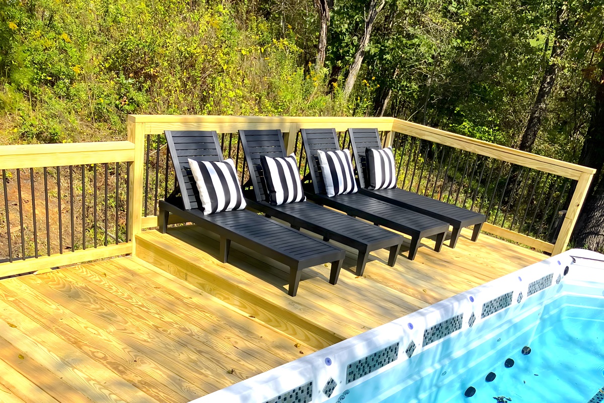 {Deck} Pool Loungers by the Heated 21 Ft Swim Spa.