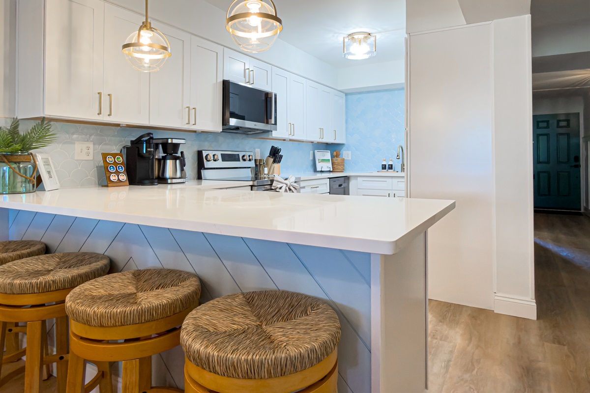 The four bar stools at the counter provide a comfortable spot for a quick breakfast before heading out to the sand.
