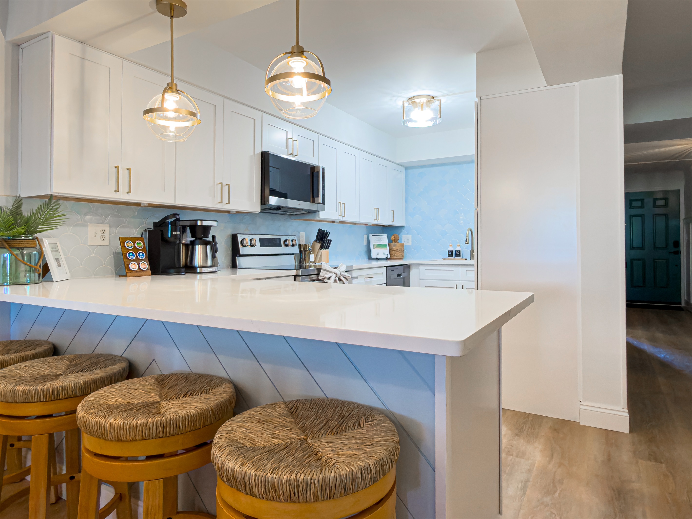 The four bar stools at the counter provide a comfortable spot for a quick breakfast before heading out to the sand.
