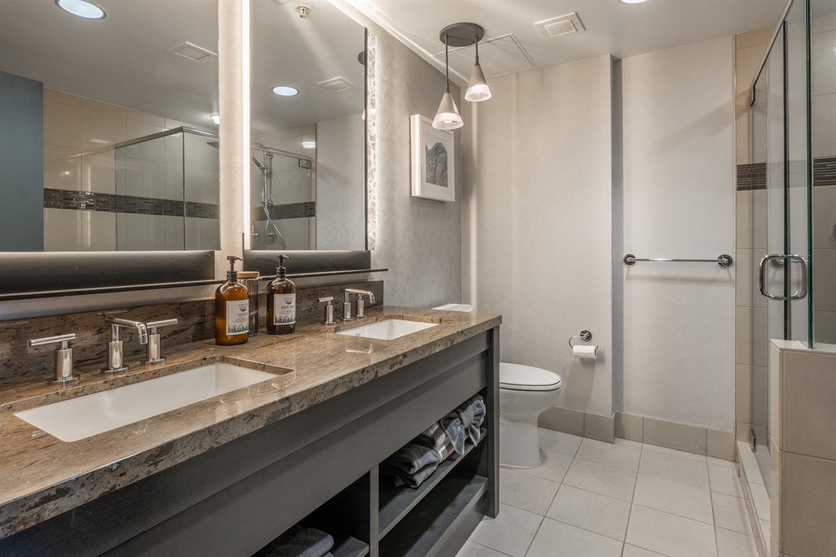 The ensuite bathroom features a spacious layout and large vanity—designed for comfort, ease, and a relaxed reset after a day in the mountains.