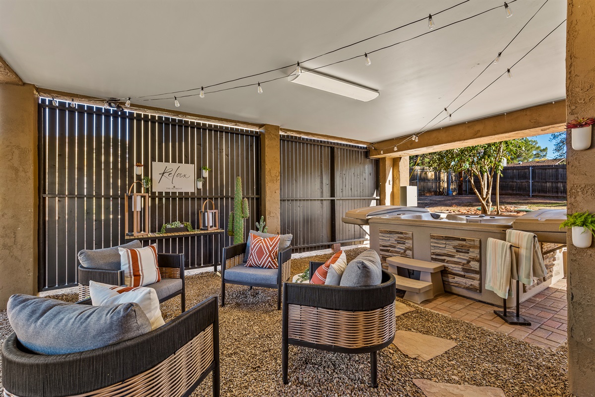 A thoughtfully designed Wellness Area featuring comfortable seating, a private hot tub, infrared sauna, cold plunge, and a calm setting for rest, recovery, and reflection.