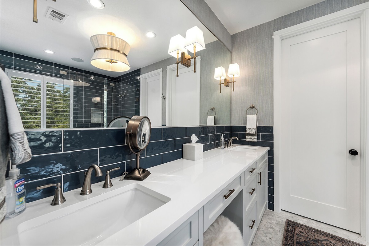 Primary bathroom with stand up shower, double sinks, and soaking tub