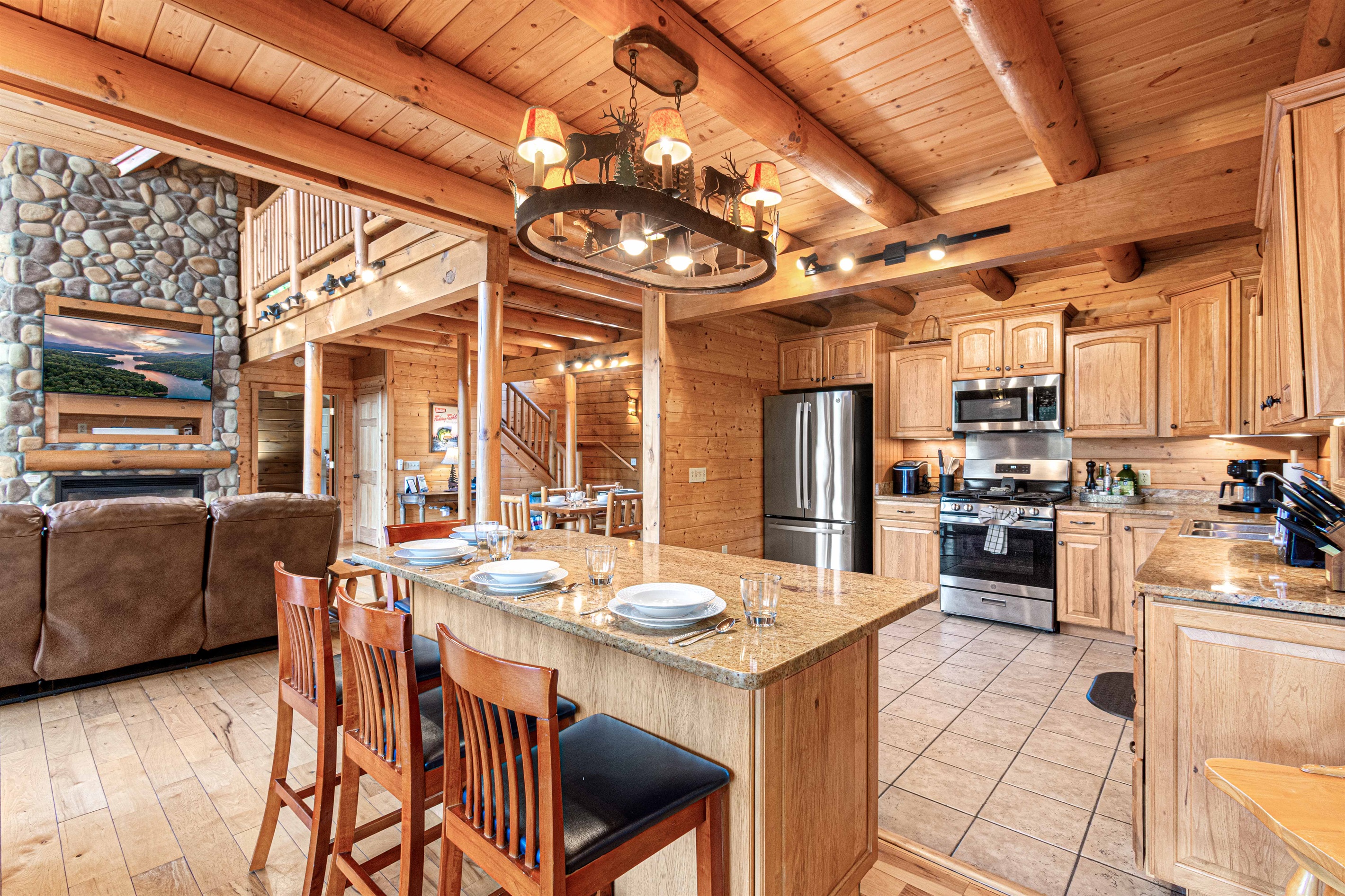Main Level Dining Room: Gather around for memorable meals in this charming, wood-beamed sanctuary!