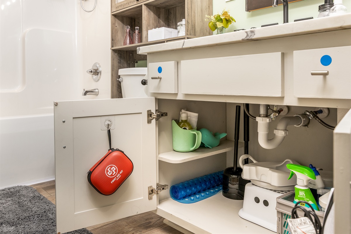 Bathrooms are stocked with practical essentials including cleaning supplies, a first aid kit, hair dryer, and baby bath accessories. Extra conveniences help guests settle in comfortably from day one.