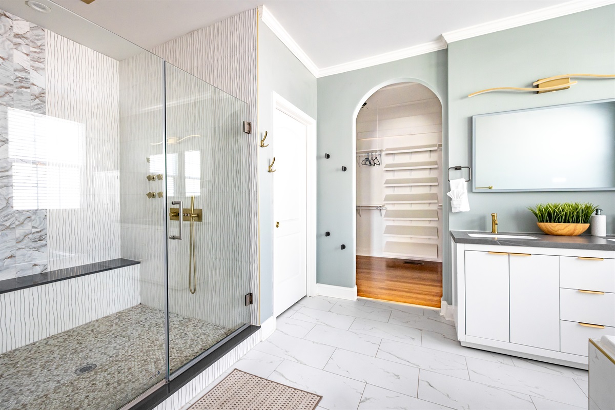 Luxury en-suite bathroom with 2-person air massaging bath, tiled rain shower, double vanity, walk-in closet