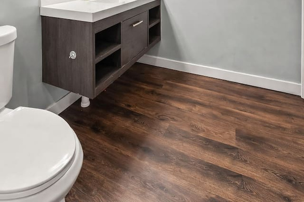 Clean vanity area with large mirror, contemporary lighting, and plenty of counter space for daily routines.