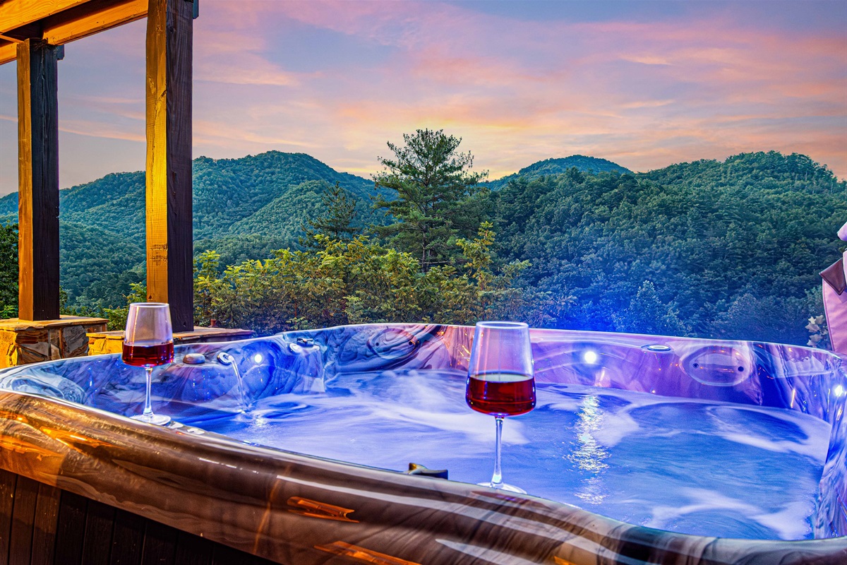 Hot Tub Retreat: Soak under starry skies with breathtaking mountain views and a glass of wine!