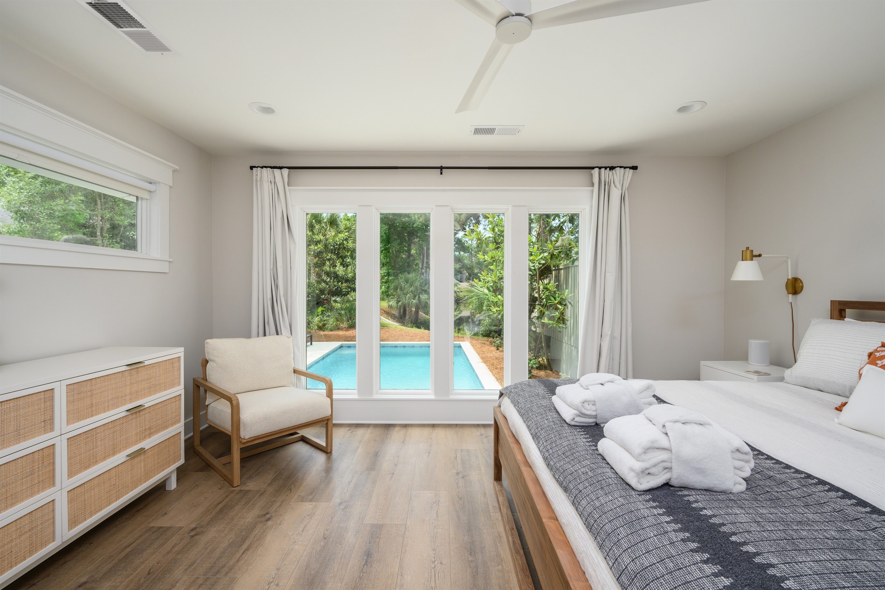 Master BR features a king bed and great view of the pool and Heritage Pond