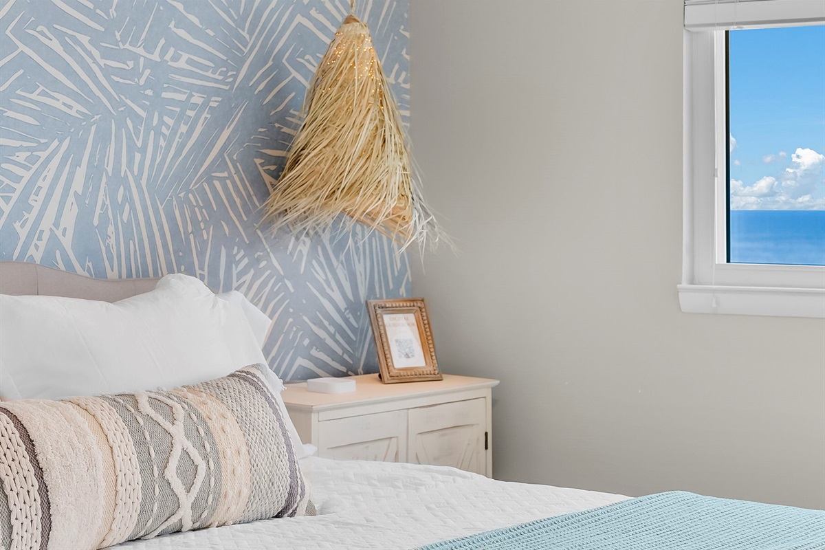 Master bedroom has sliding glass doors that go out onto the private balcony with stunning ocean views for miles and miles.
