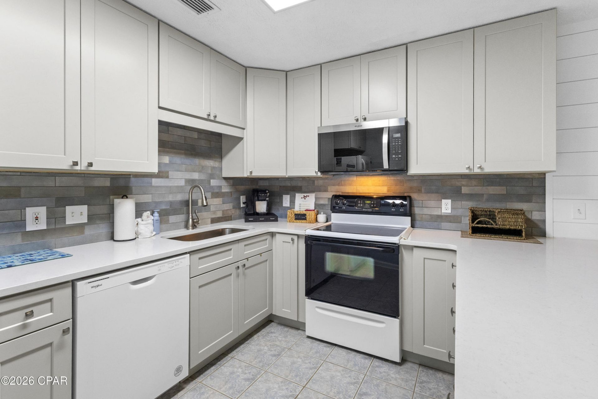 Fully equipped kitchen with everything needed for easy vacation meals, beach snacks, and family dinners during your Panama City Beach stay.