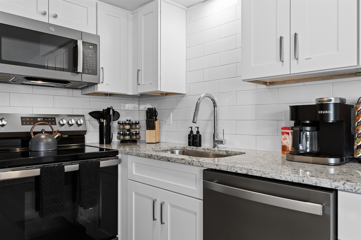 Savor the details—gleaming countertops, subway tile backsplash, and premium appliances for all your cooking needs.