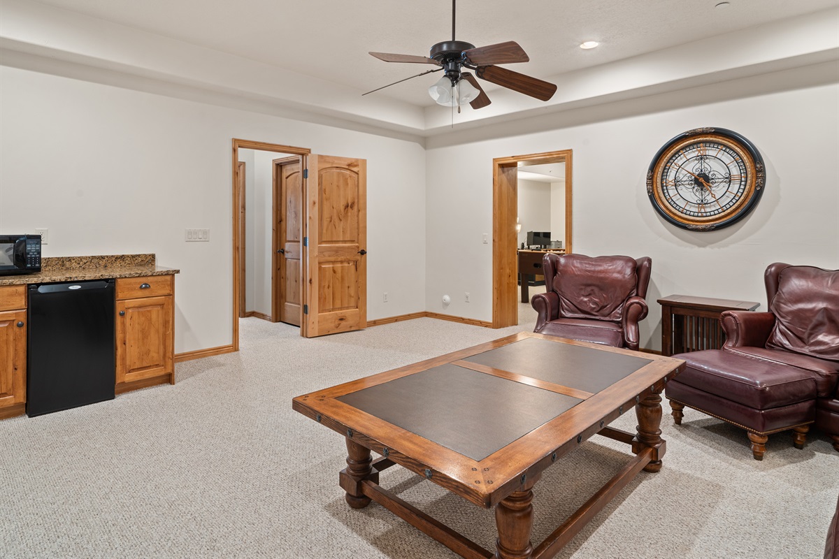 Secondary living area with seating and game table