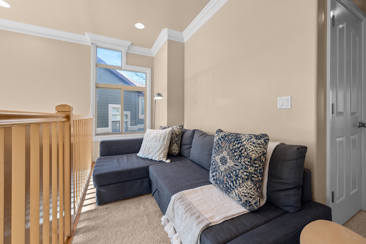Cozy loft seating area—perfect for reading, relaxing, or quiet moments.