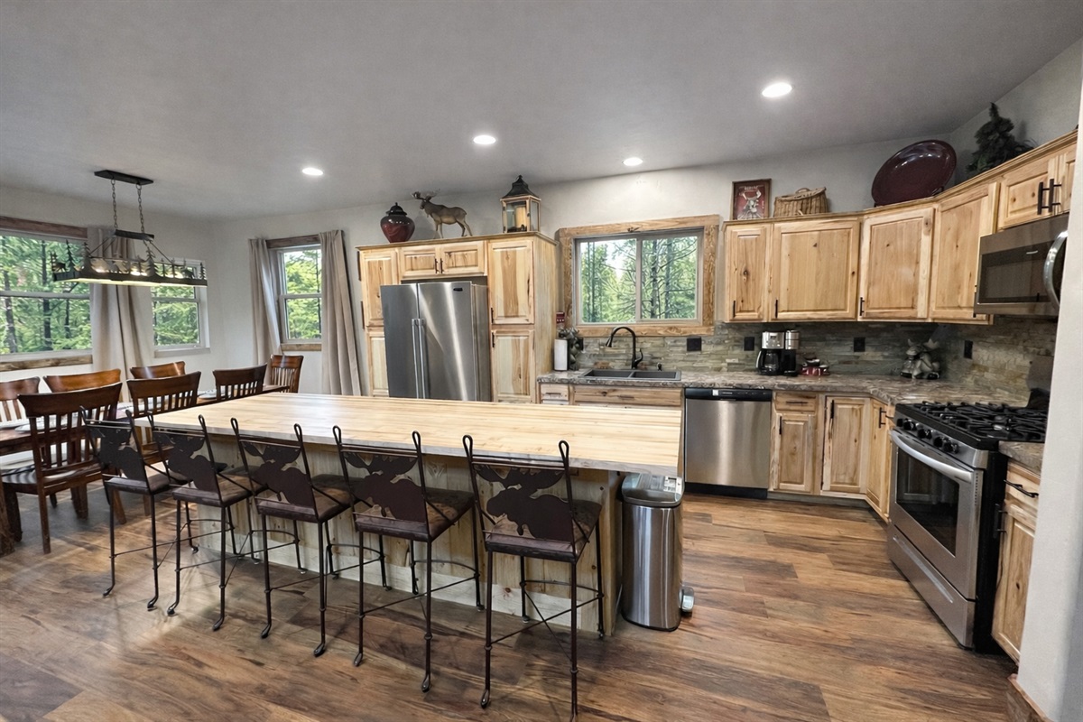 Generously equipped kitchen with everything necessary to create and enjoy meals at home, including a large spice/seasoning selection, cooking oils, quality cookware, condiment assortment, coffee selection with cream and sweeteners, etc.