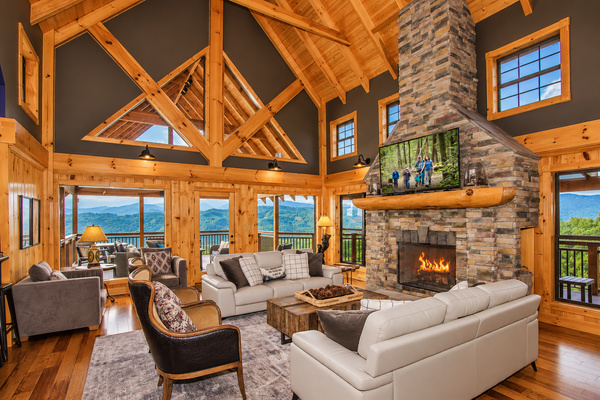 Main-floor great room with stone fireplace, golden wood and big views, Splashing at the Bluff