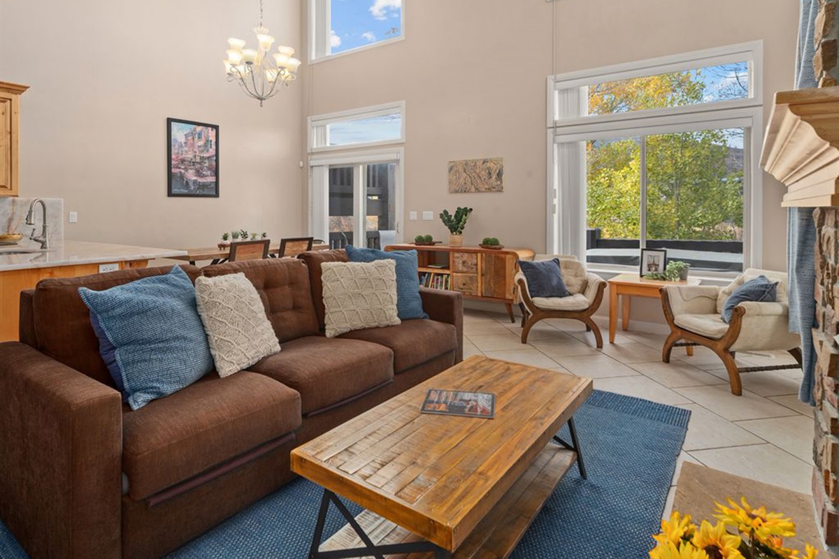Bright, spacious living room with soaring ceilings and abundant natural light.