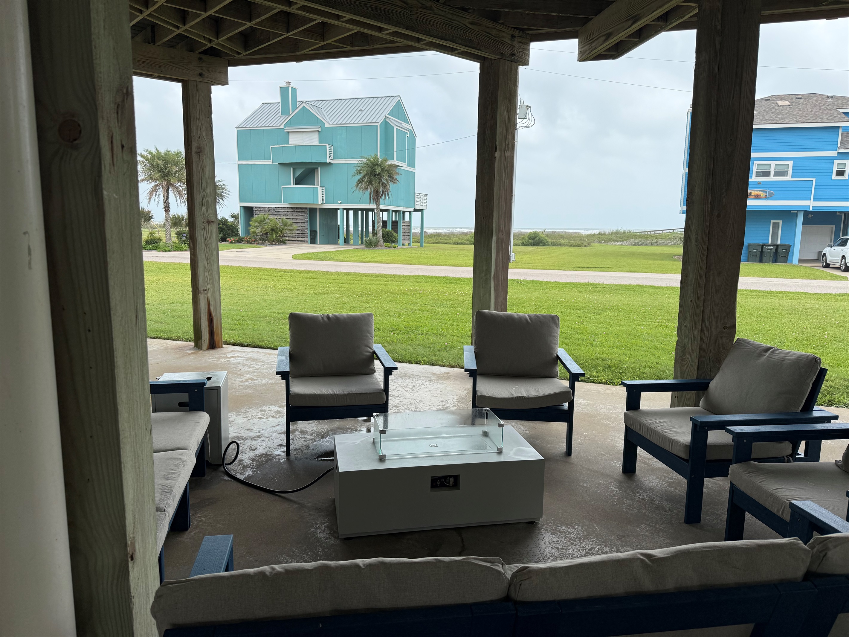 Enjoy the gas firepit while resting in the shade, listening to the waves.