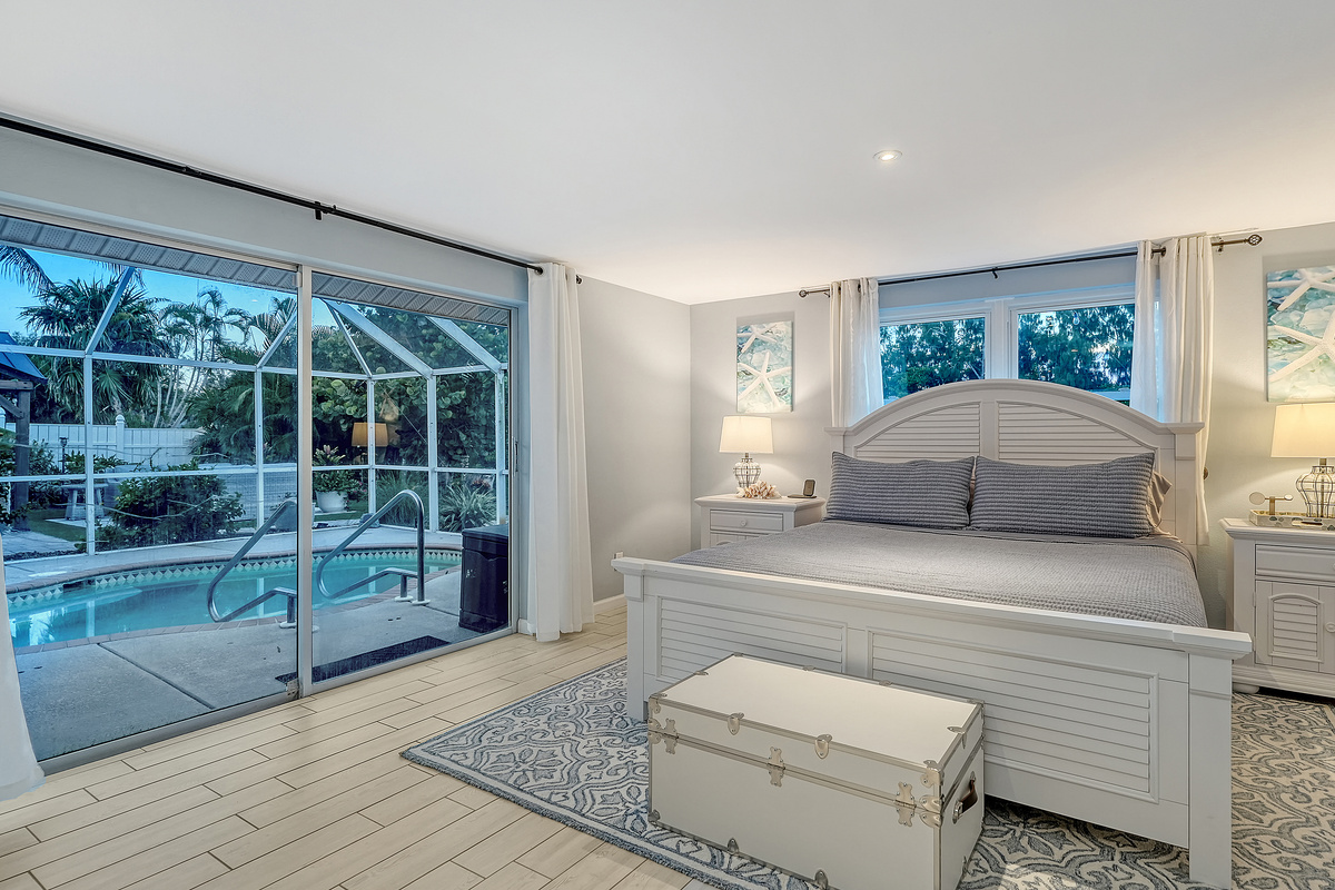 Primary suite has a sliding door to the pool deck.
