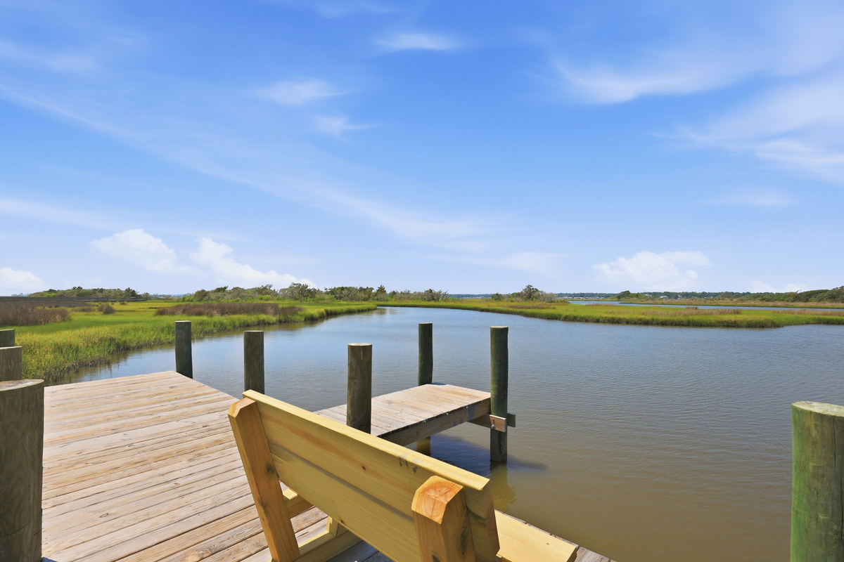 Relax on the private dock and take in peaceful marsh views from your own waterfront retreat