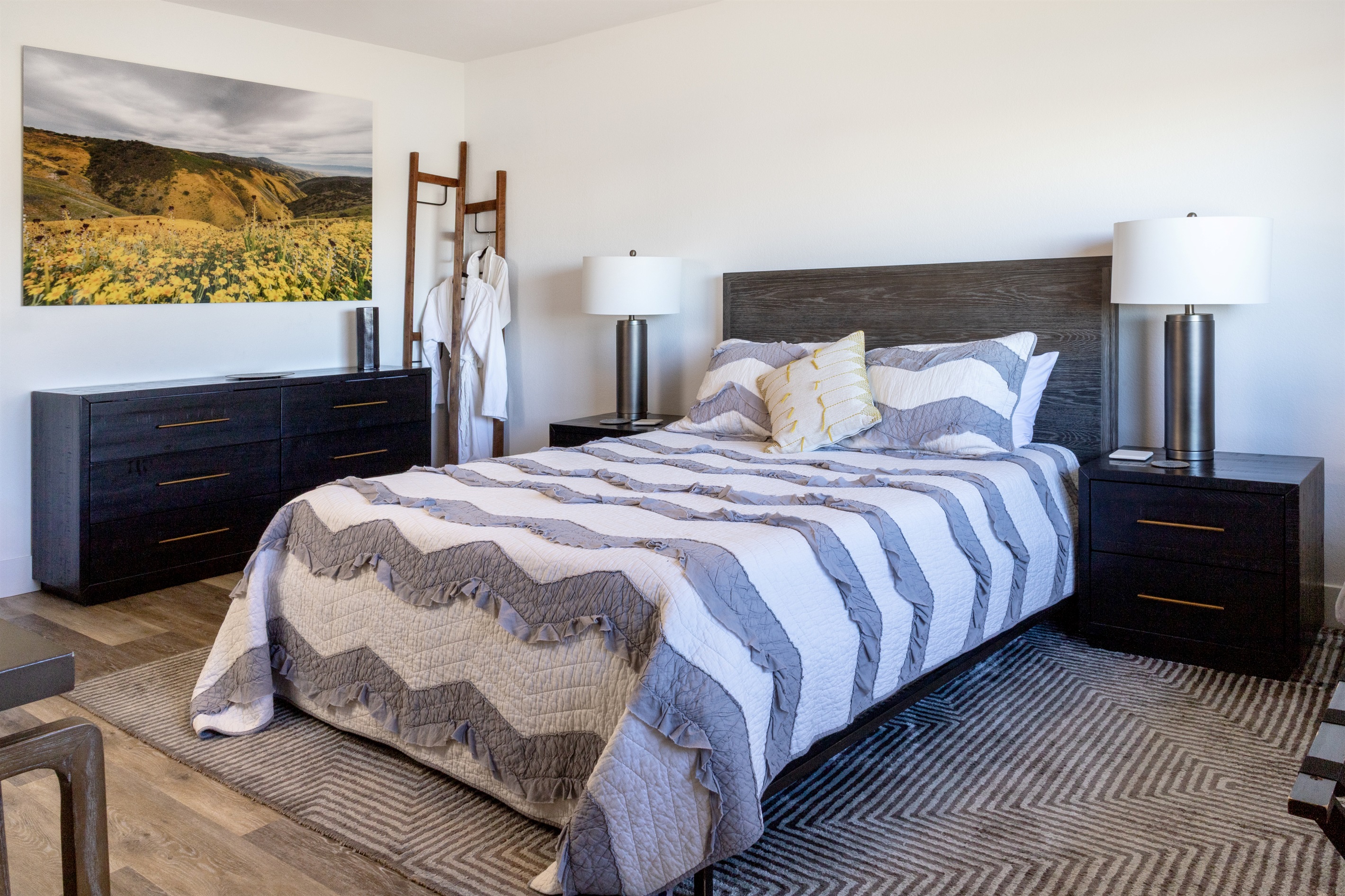 Wake up surrounded by vineyard views and California wildflower art. Plush robes, elegant furnishings, and a king bed dressed in soft chevron linens await.