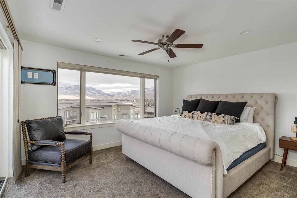 Spacious primary suite with king bed and incredible mountain vistas