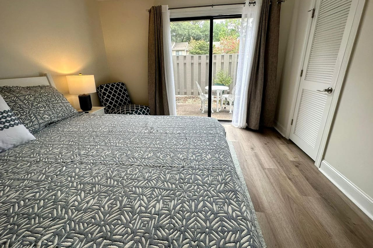 Bedroom with doors to the patio