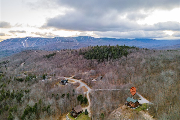 This aerial view reveals the beauty of the home nestled in nature’s embrace.