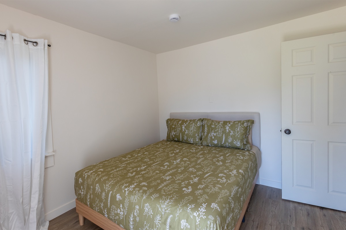 Quiet, inviting space with a queen bed in bedroom two