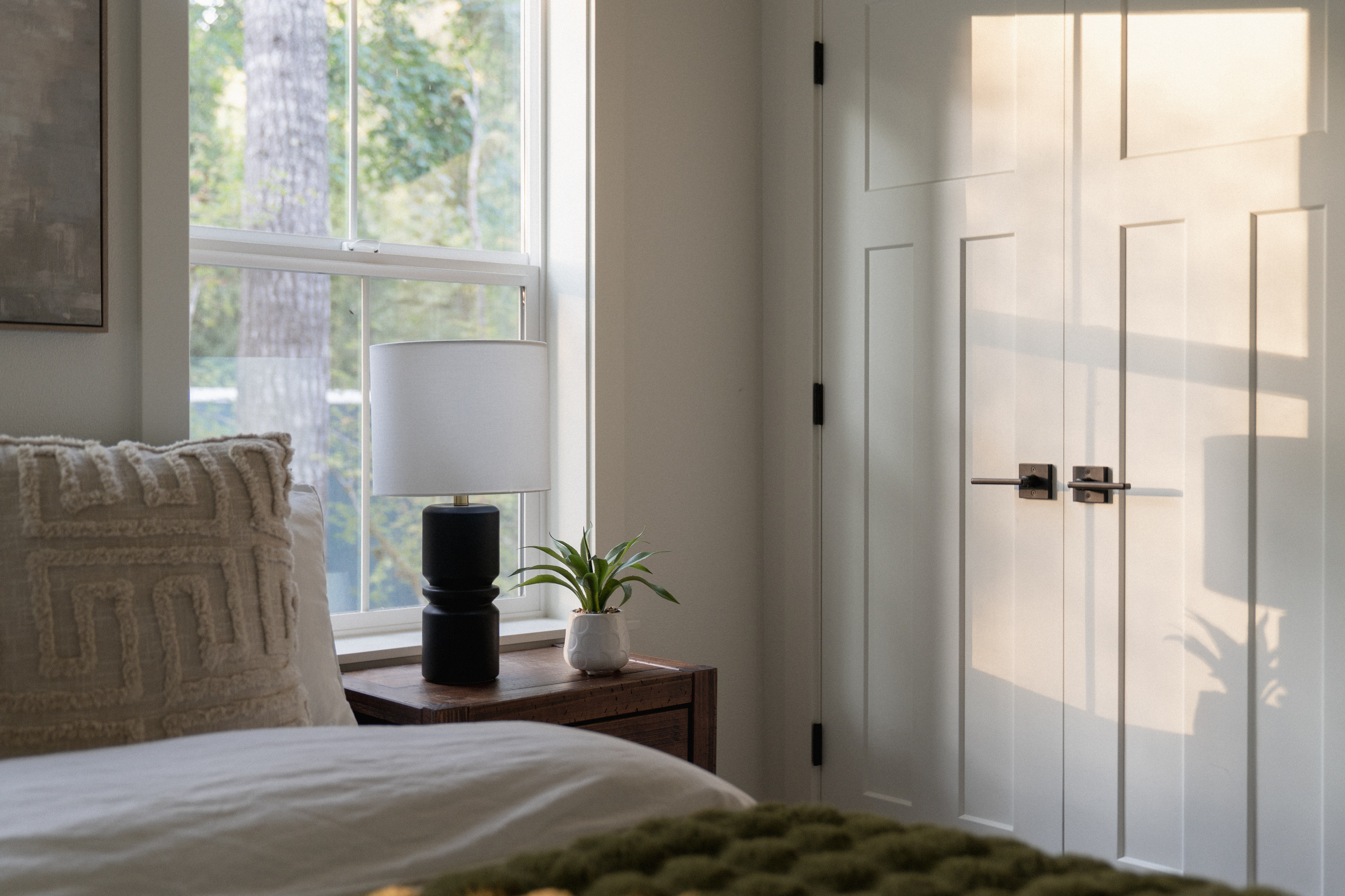 Soft light, forest views — your bedroom retreat awaits.