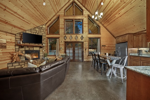 The wall of windows lets the natural light spread throughout the living room and kitchen.