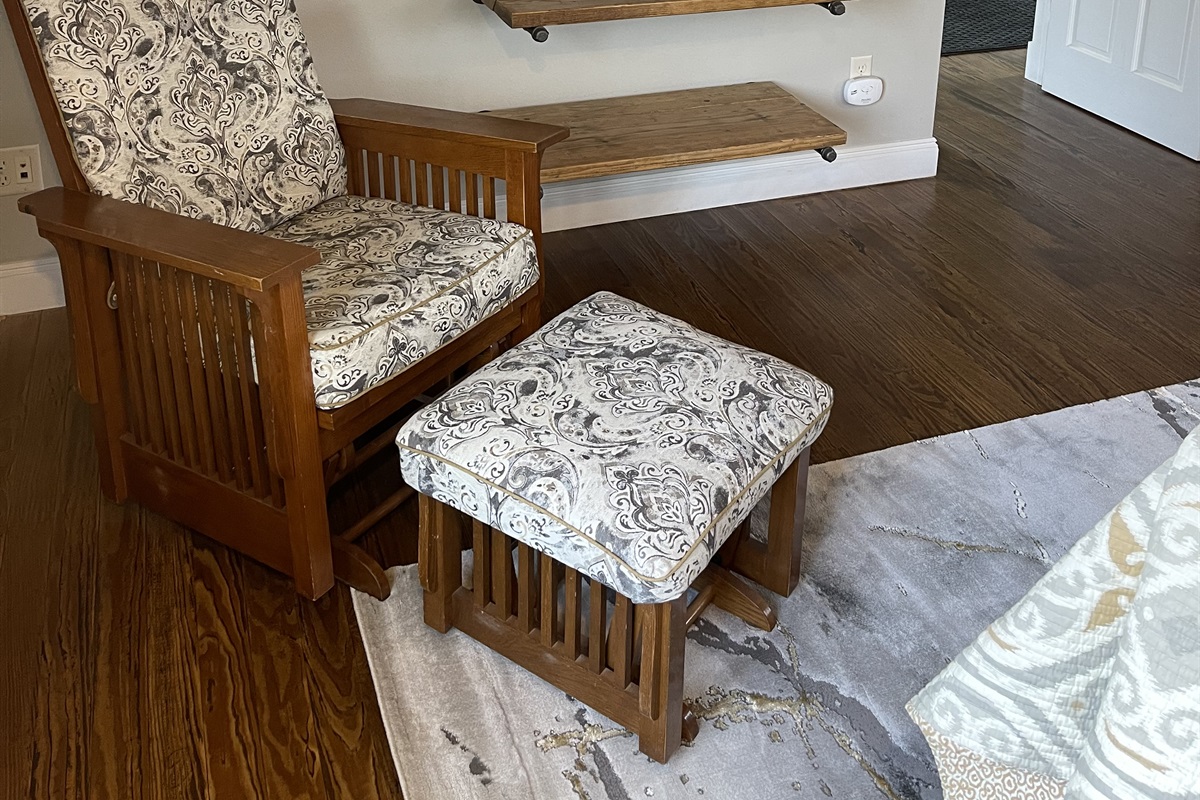 Comfy glider in primary bedroom