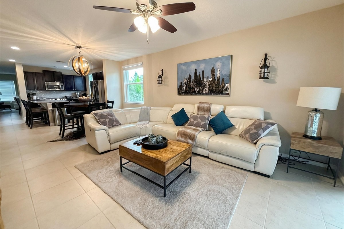 Plush sectional seating and Smart TV — your home away from home. Seats of the couch recline on two sides.