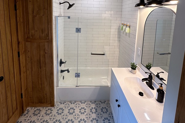 Upstairs hall bathroom with tub and shower
