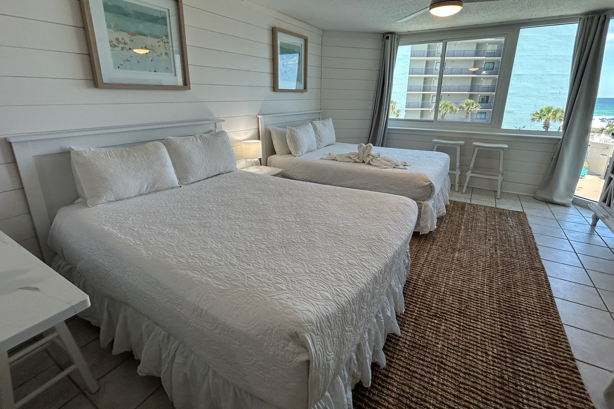 Perfect for couples or small families, this studio offers two queen beds, coastal charm, and a great view of the Emerald Coast.