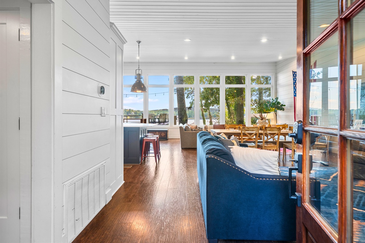 Open flow from living to kitchen with views that bring the outdoors inside.