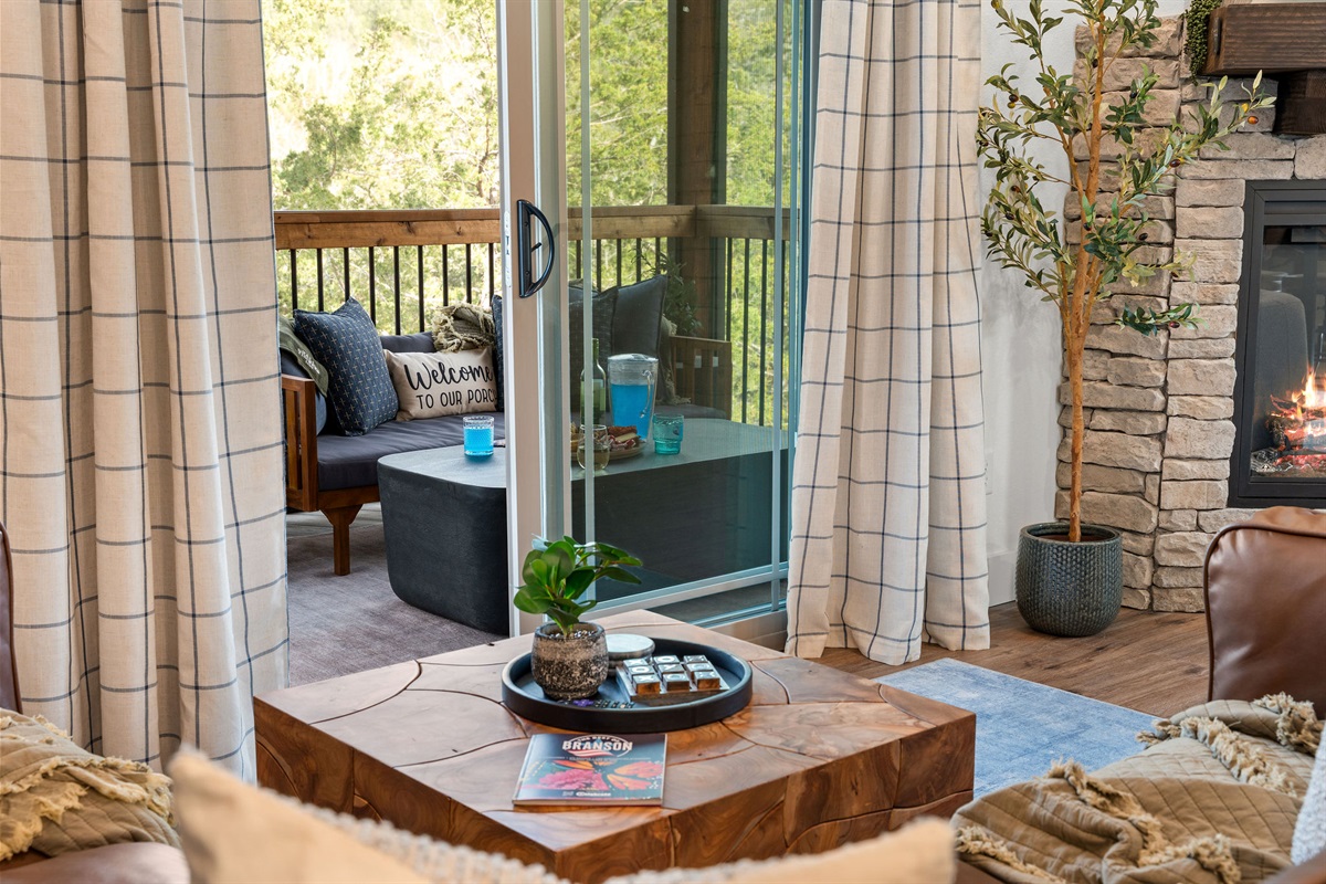 From the main living area, walk out onto the main level private deck with screened in area, dining and propane bbq grill.