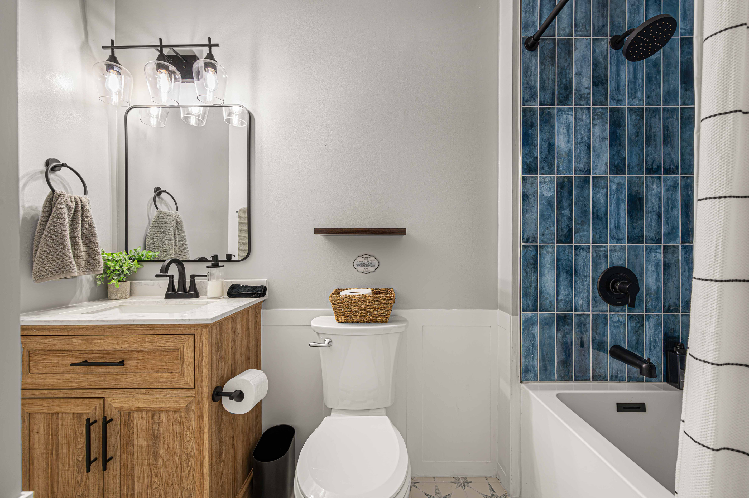 Bathroom Oasis: Stylish retreat with modern fixtures and chic tile accents for ultimate relaxation!