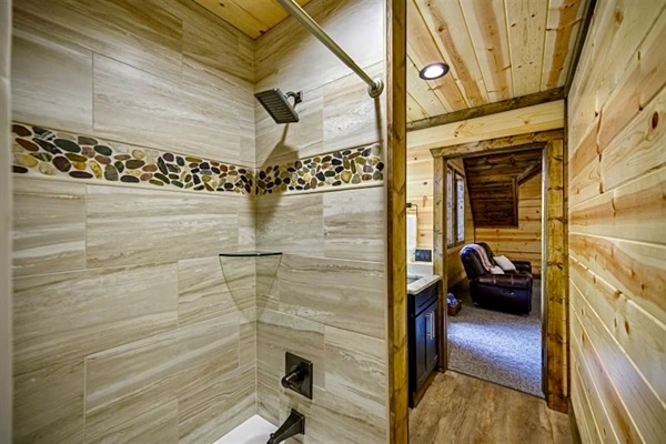 Bright, modern, and refreshing—this ensuite bathroom features a spacious walk-in shower, sleek finishes, and everything you need to unwind in comfort