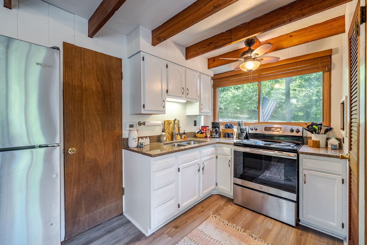 Cook a full dinner  — this kitchen has a real range, granite counters, and all the basics for preparing your meals.