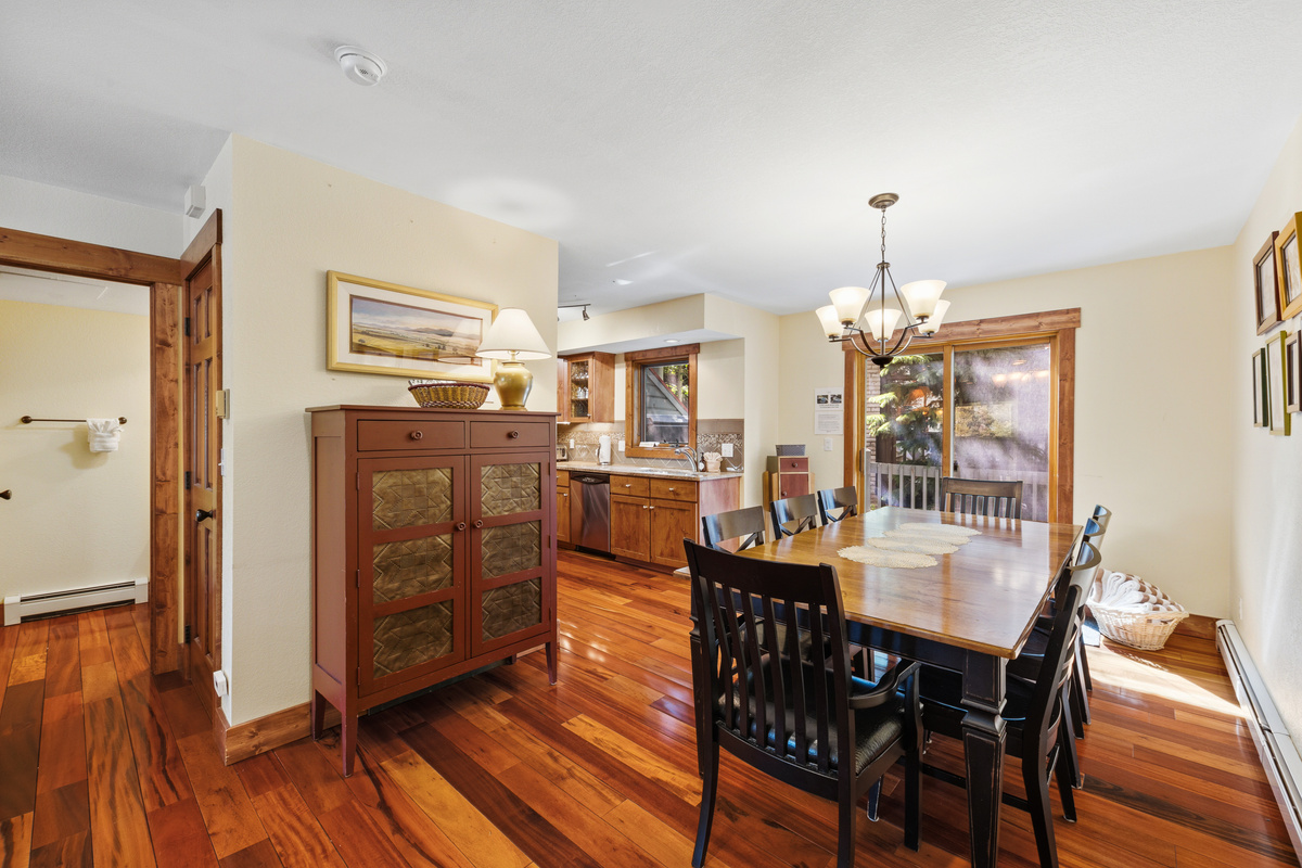 Dining area with seating for 8. An additional leaf and two chairs are in the home to add seating for up to 10. Pantry for food storage in center.  