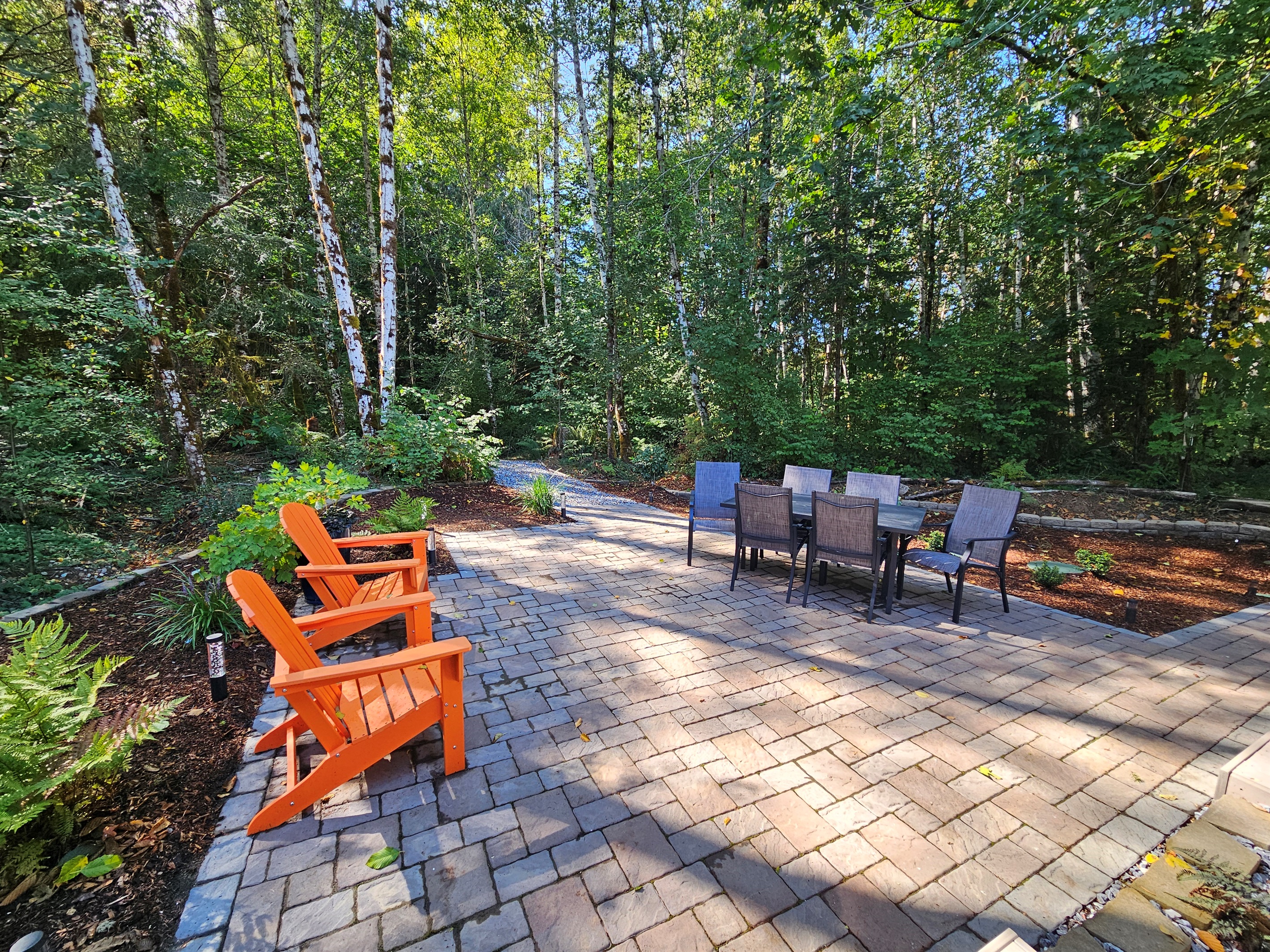 A wetland forest trail departs the patio and intersects the property-wide trail system, leading to picnic areas and the shores of Mill Creek, where you may launch kayaks into Lake Isabella.